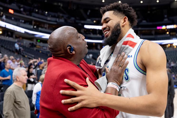 Karl Towns, Sr. hugging his son, Karl-Anthony Towns of the Minnesota Timberwolves, after a game at the NBA Western Conference Semi-finals