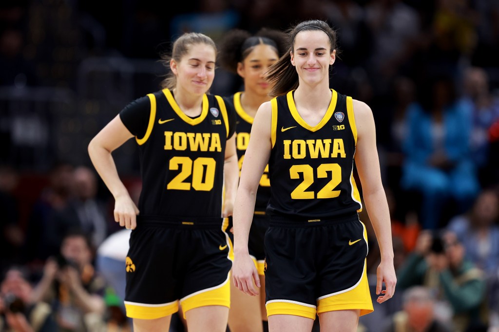 Kate Martin #20 and Caitlin Clark #22 of the Iowa Hawkeyes take the court before the 2024 NCAA Women's Basketball Tournament National Championship against the South Carolina Gamecocks at Rocket Mortgage FieldHouse on April 07, 2024 in Cleveland, Ohio.