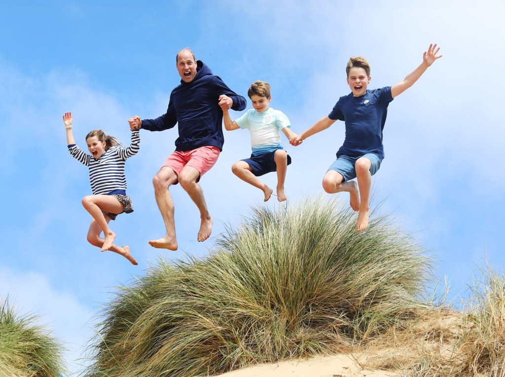 Prince William and his kids jumping in the air in a playful photo shared by Kate Middleton for his 42nd birthday
