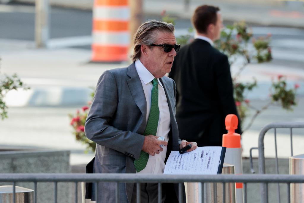 Kevin Morris in a suit and tie, holding a piece of paper, arriving at the federal court for Hunter Biden's trial on June 10, 2024 in Wilmington, Delaware.