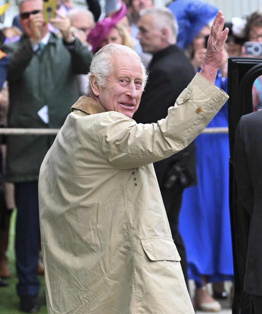 King Charles III waving at the crowd during Ladies Day at The Betfred Derby at Epsom Downs Racecourse, 31st May 2024.