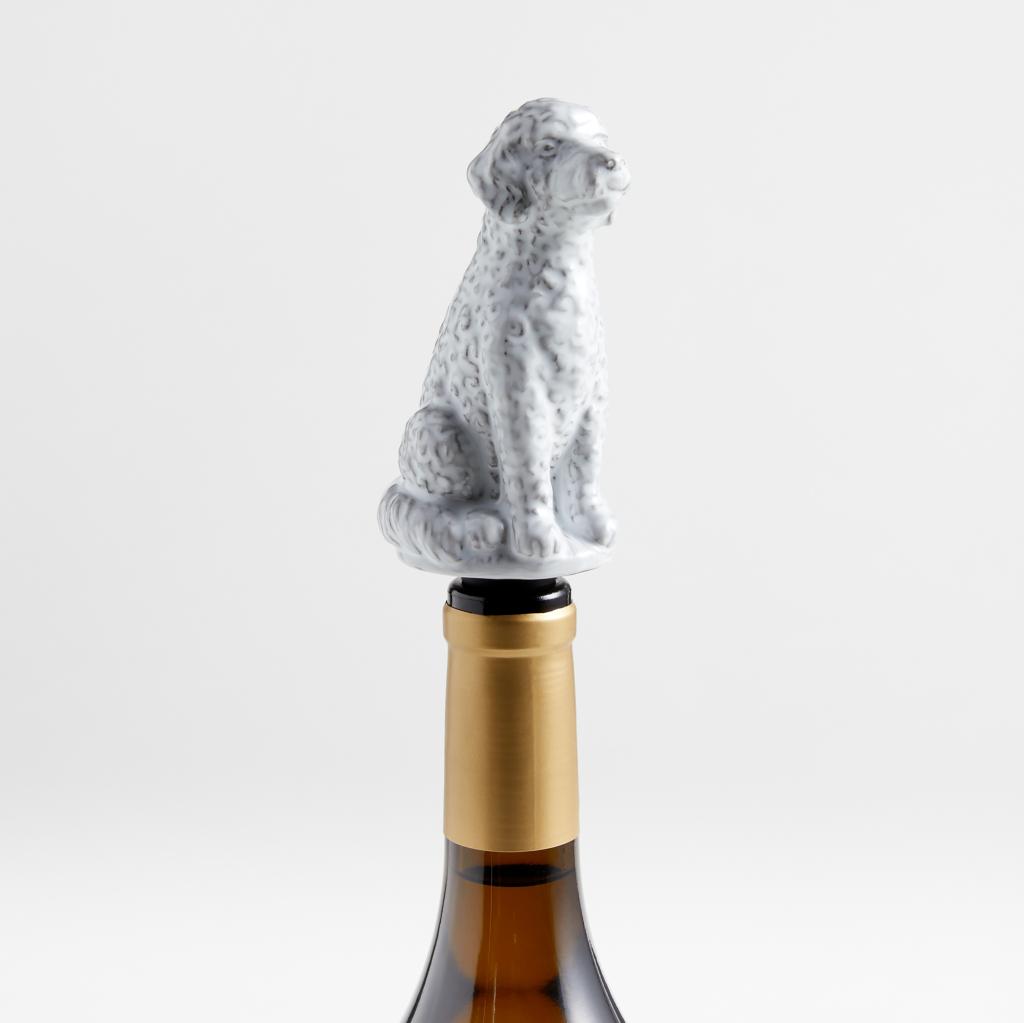 King of Soho Goldendoodle Ceramic Wine Stopper by Laura Kim on a wine bottle, photo courtesy of Crate and Barrel