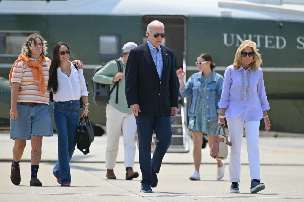 President Joe Biden and First Lady Jill Biden with daughter Ashley (2R), granddaughters Maisy (L) and Naomi (2L) and Naomi's husband Peter Neal (3L) make their way to board Air Force One before departing Los Angeles International Airport in Los Angeles, California on June 16, 2024.