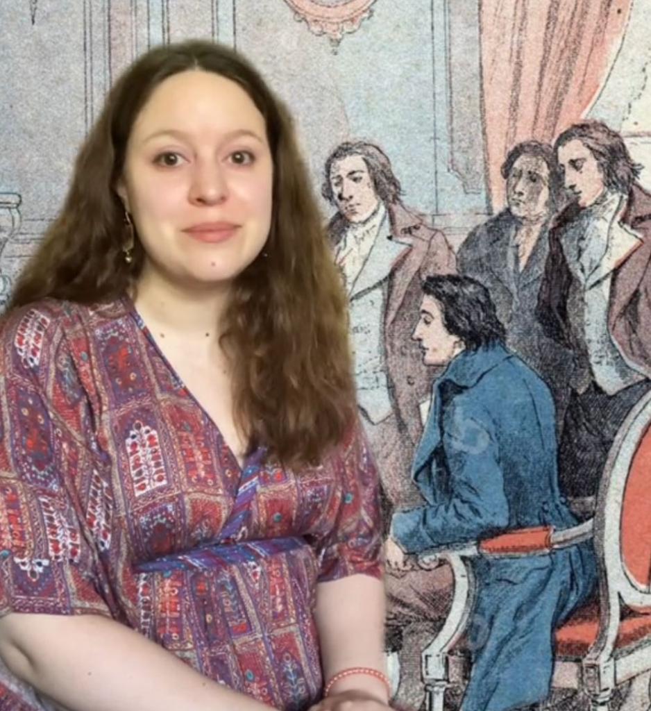 A woman standing in front of a painting, contributing to the 'digitine' movement on TikTok, in response to Kalil's comments.