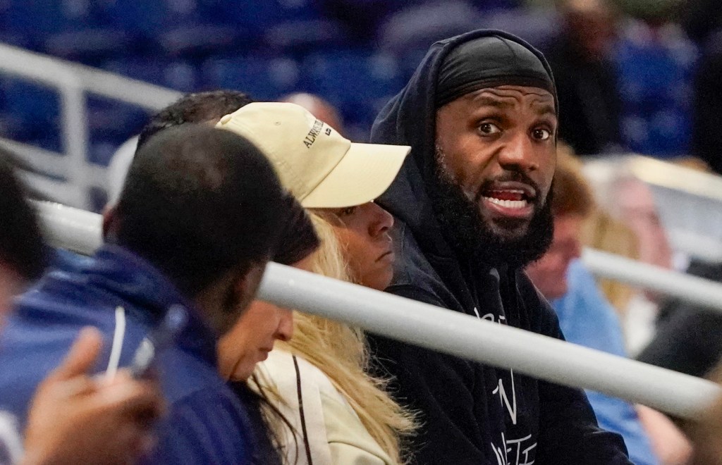 LeBron James and his wife Savannah Brinson watch Bronny James participate in the 2024 NBA Draft Combine