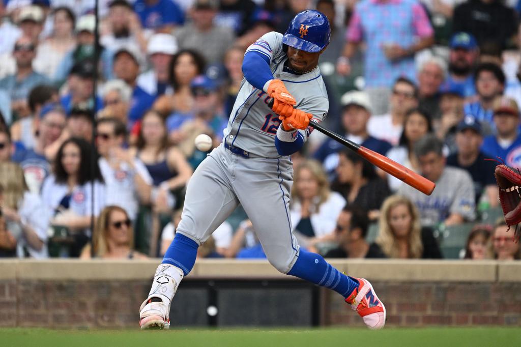 Francisco Lindor #12 of the New York Mets hits a two-run home run in the third inning against the Chicago Cubs at Wrigley Field on June 23, 2024 in Chicago, Illinois.