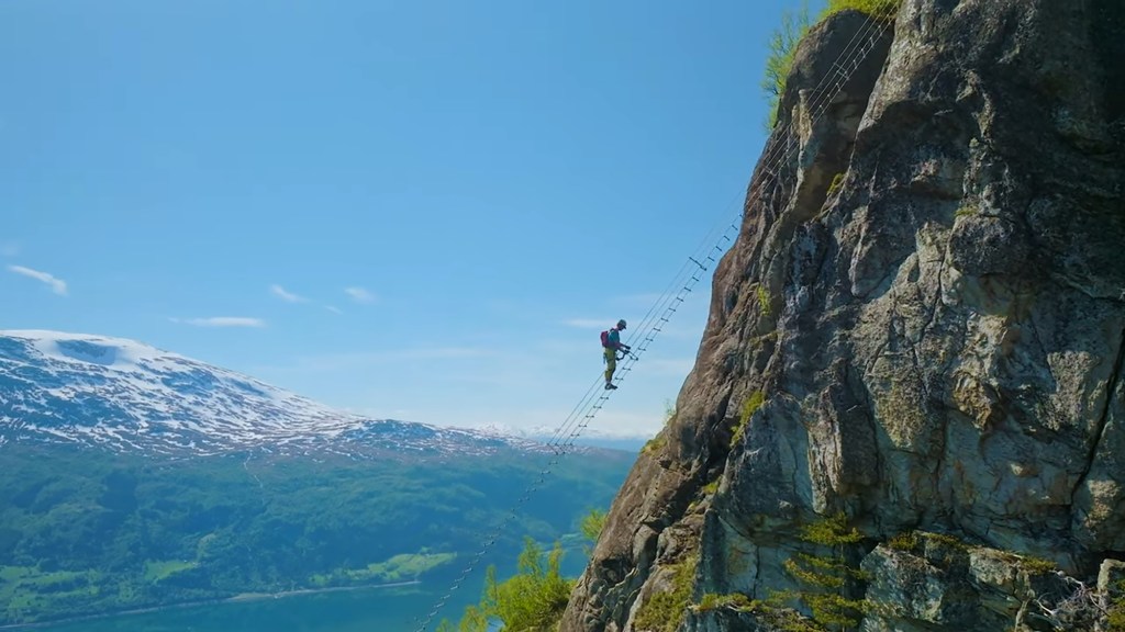Climbers ascending the new 40-meter ladder segment, STIGULL, on the Via Ferrata Loen climbing route in Norway's northwest