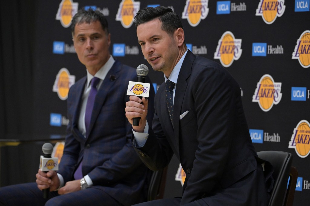 New Lakers coach JJ Redick (r.) speaks to the media on Monday as GM Rob Pelinka looks on.