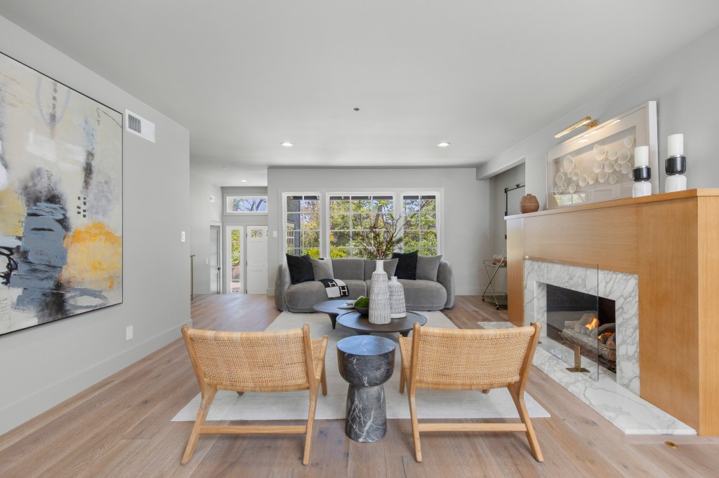 The formal living room with a fireplace.