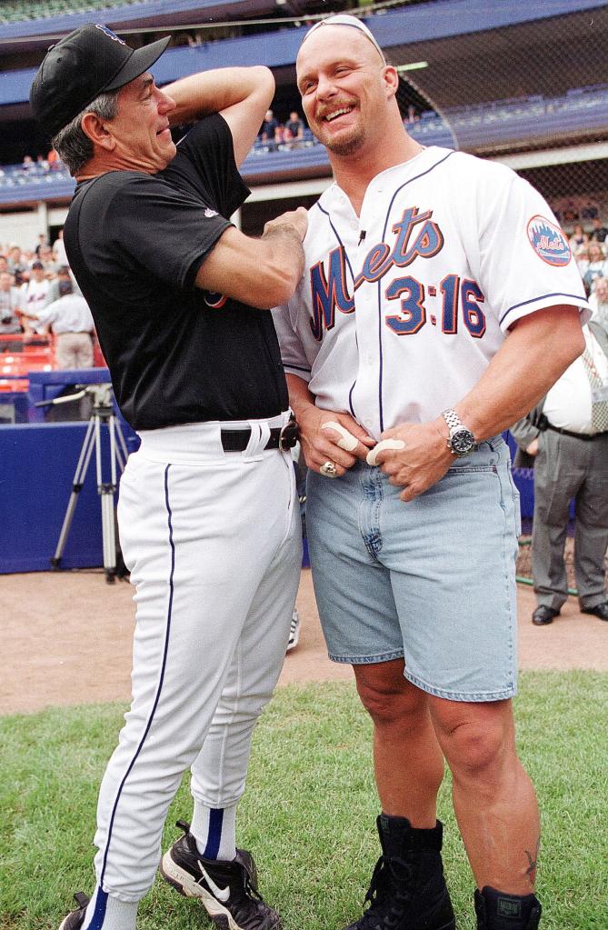 Manager Bobby Valentine (L) of the New York Mets takes on World Wrestling Federation Champion Stone Cold Austin prior to the game between the New York Yankees and the New York Mets at Shea Stadium in the Bronx, NY on Saturday July 10, 1999 