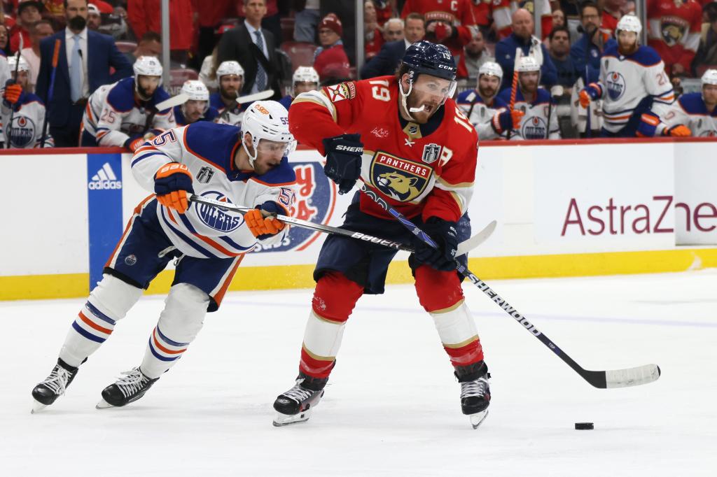 Matthew Tkachuk (19) fights for the puck against the Oilers in Game 5 of the Stanley Cup Final on June 18, 2024.