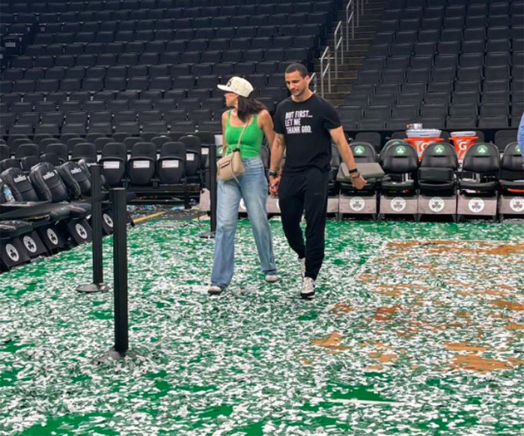 Joe Mazzulla and his wife Camai Mazzulla walk around TD Garden after the Celtics' Game 5 win over the Mavericks to win the NBA Finals on June 17, 2024. 