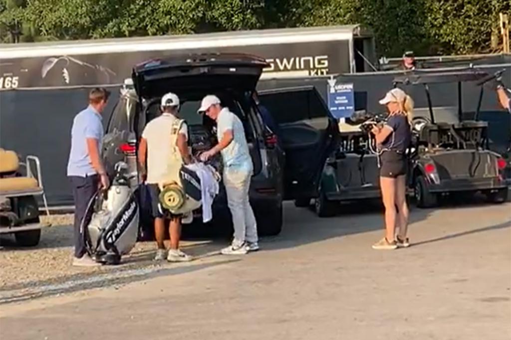 Rory McIlroy packs up a car shortly after losing the U.S. Open.