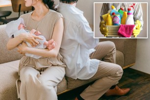 couple with baby and a basket of cleaning supplies being held