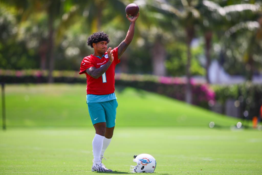 Miami Dolphins quarterback Tua Tagovailoa throwing a football during mandatory minicamp at Baptist Health Training Complex