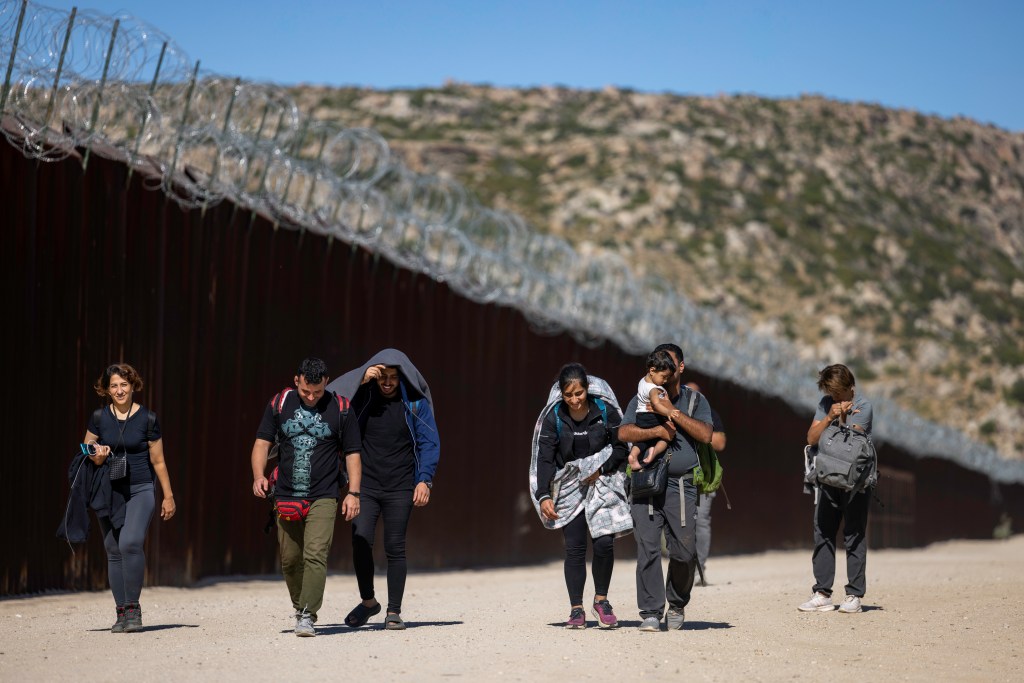 Migrants cross into the San Diego sector of the southern border, which has become the top region for illegal crossings.