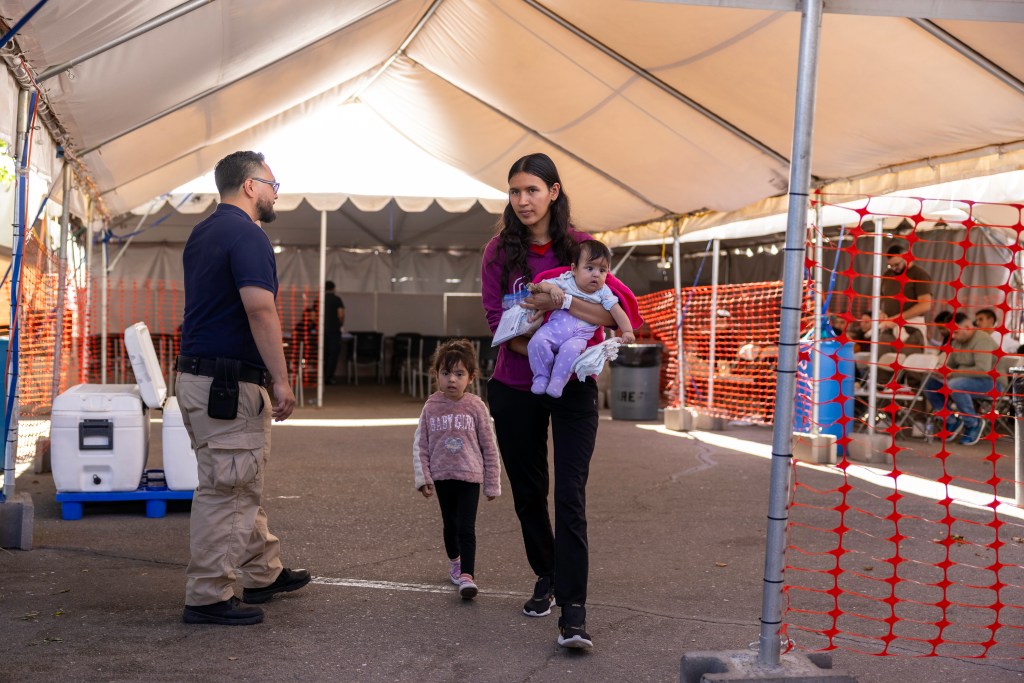 Migrants arrive at the Regional Center for Border Health in Yuma, Arizona, after being released by Border Patrol agents.