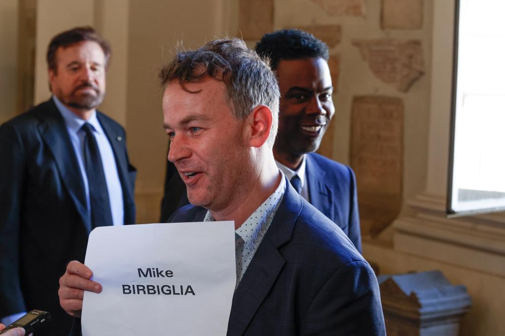 Mike Birbiglia held a placard with his name at The Vatican.