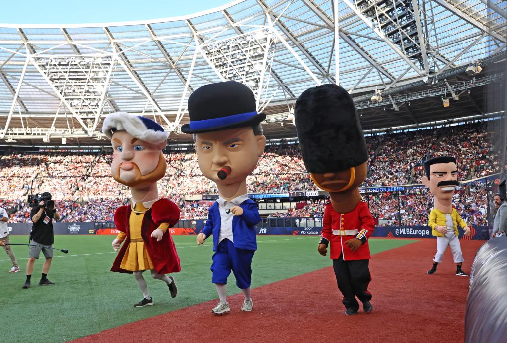 Mascots of New York Mets and Philadelphia Phillies running a race on the field during the MLB London Series at London Stadium