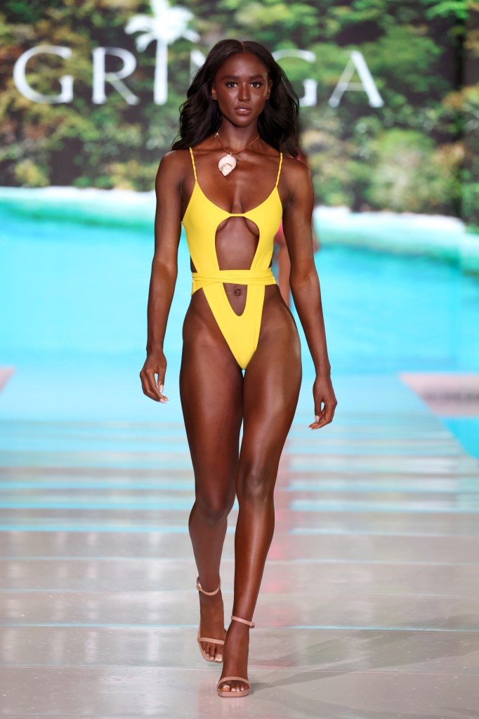 A model walking the runway in a yellow swimsuit for Gringa Swimwear at Miami Swim Week, SLS South Beach, May 31, 2024.