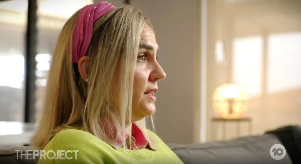 Woman with blonde hair and pink headband, Sally Murali, who underwent a hysterectomy for chronic urinary tract infections with unresolved symptoms