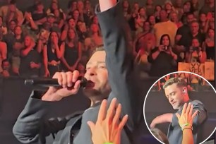 Justin Timberlake has been caught on camera angrily slapping away a fan’s hand when they tried to reach out and touch his arm during a concert.