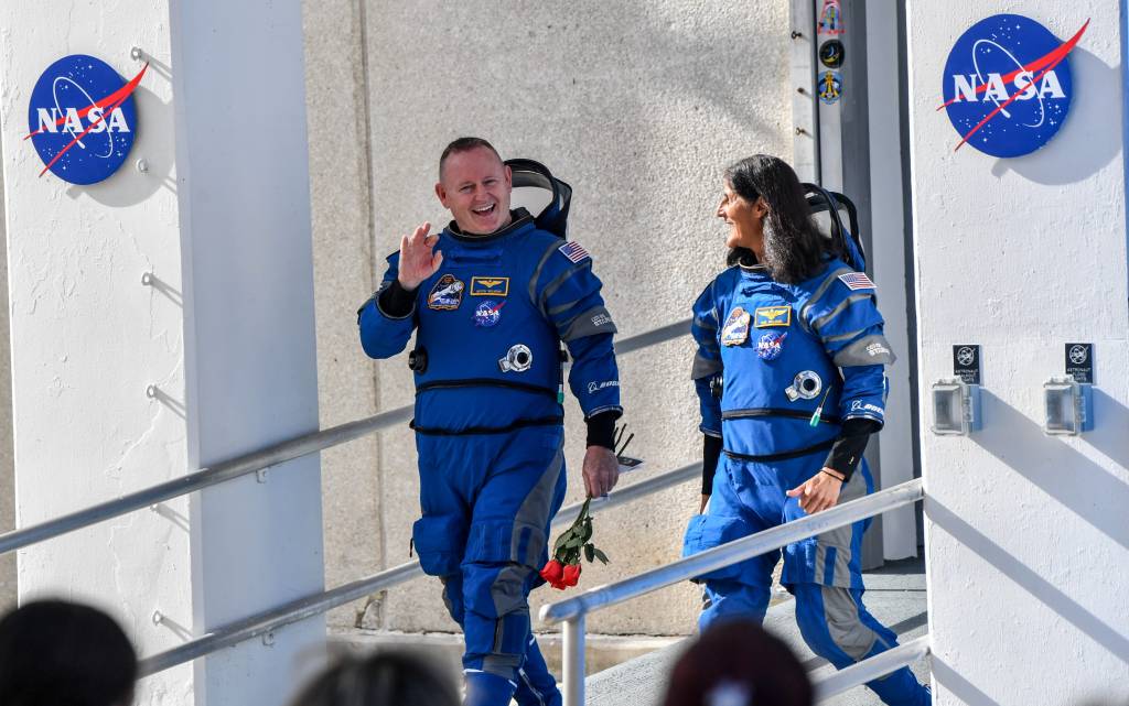 NASA astronauts Suni Williams and Butch Wilmore say goodbye to friends and family as they leave astronaut crew quarters on their way to the launch pad Saturday, June 1, 2024. 