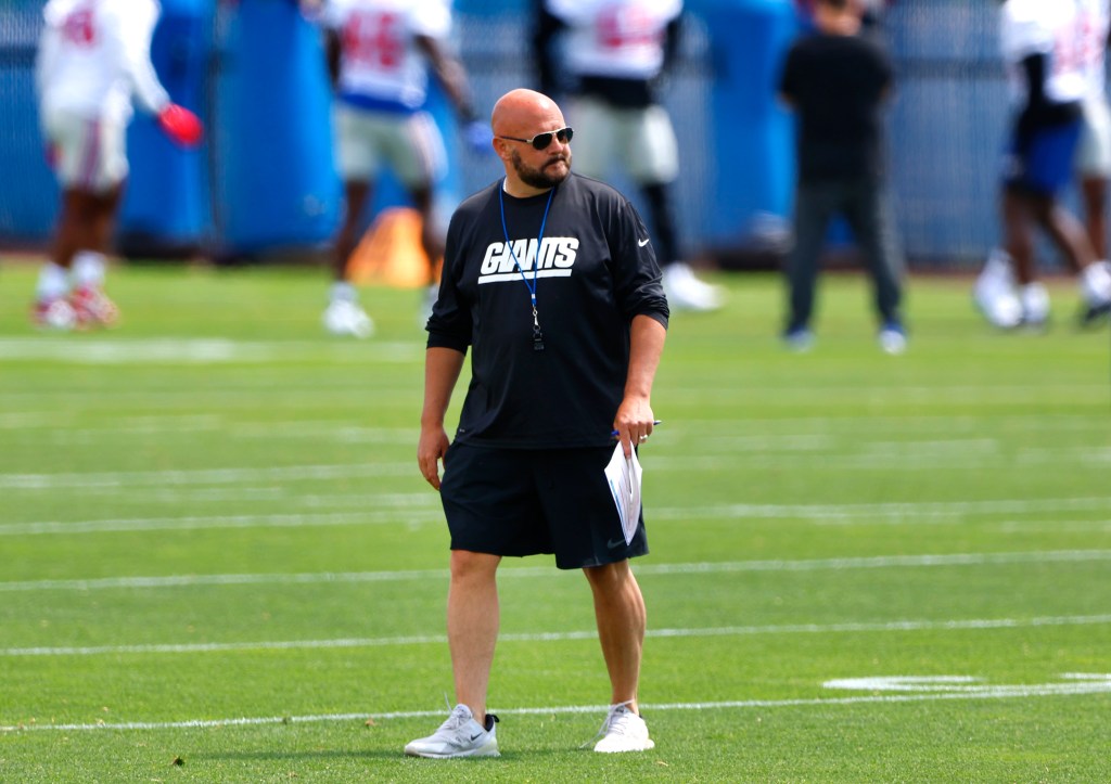 Brian Daboll, New York Giants head coach, standing on a field during minicamp in East Rutherford, N.J., June 11, 2024