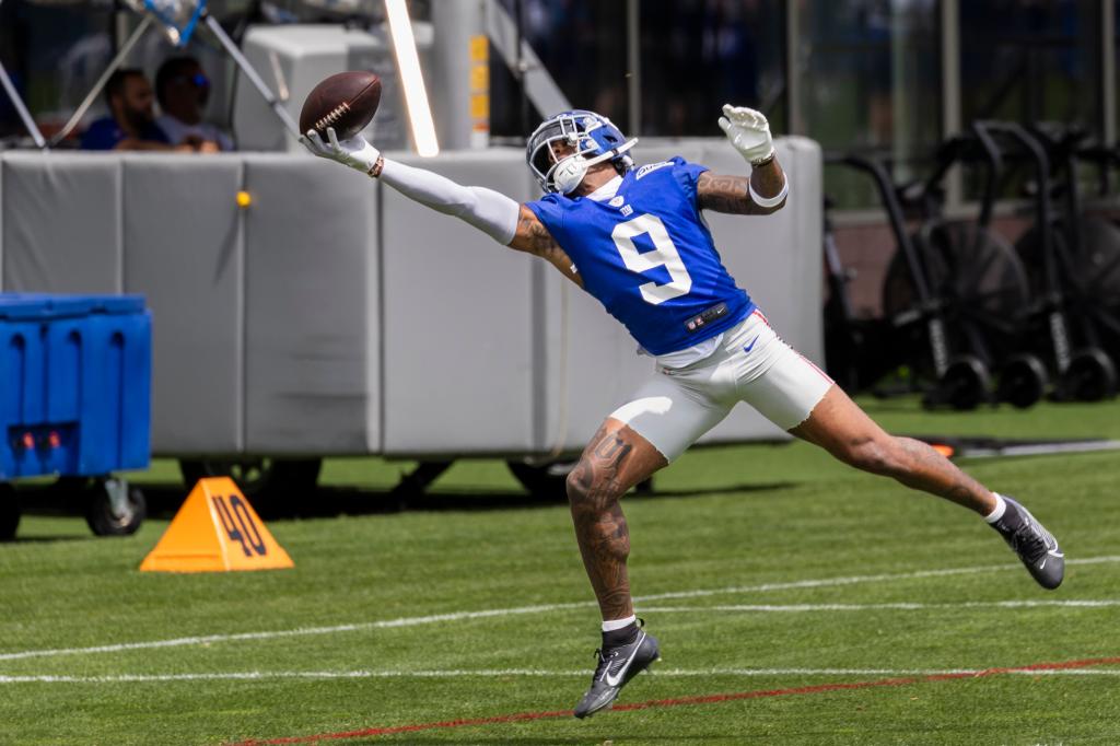 Wide receiver Malik Nabers makes a catch during Giants minicamp in June 2024.