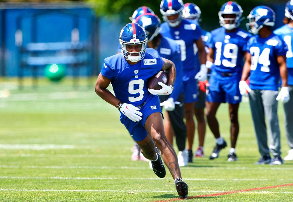 New York Giants wide receiver Malik Nabers running with a football during Rookie Minicamp in East Rutherford, N.J.