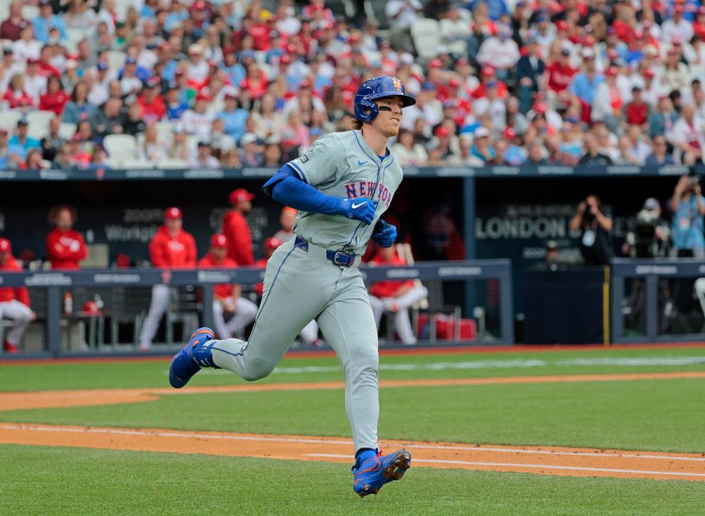 New York Mets player Brett Baty running on the field after hitting a single during a game against the Philadelphia Phillies at London Stadium