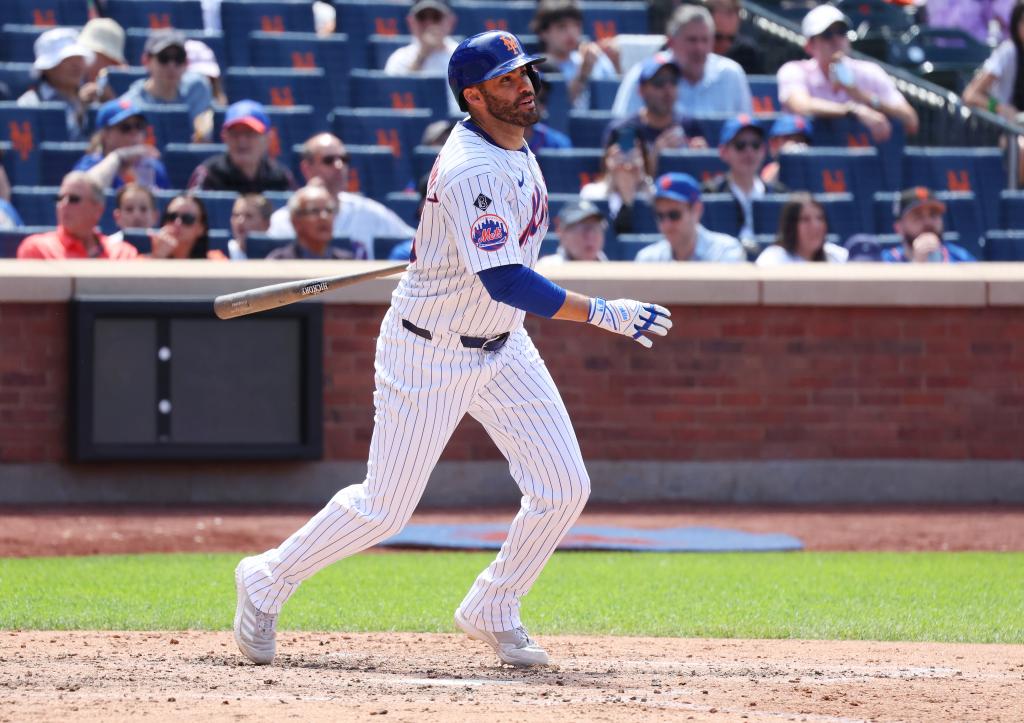 J.D. Martinez of the New York Mets in action, hitting an RBI double during a game against the San Diego Padres at Citi Field