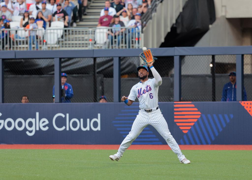 New York Mets outfielder, Starling Marte, fielding a run-scoring hit by Philadelphia Phillies Edmundo Sosa during MLB London Series at London Stadium