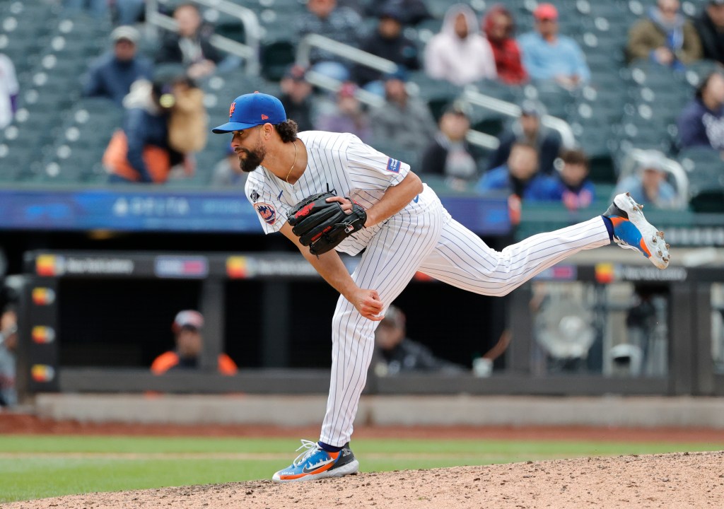 Mets relief pitcher Jorge Lopez throws a pitch