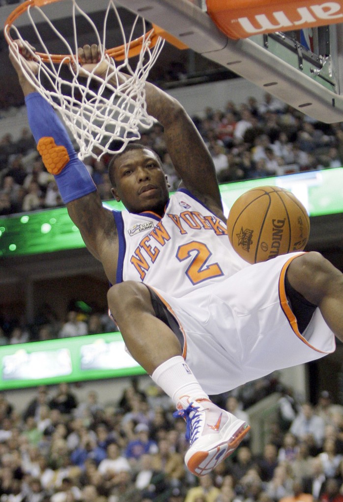 New York Nicks Nate Robinson dunks during the slam dunk contest during the NBA basketball All-Star Saturday Night on Saturday, Feb. 13, 2010, in Dallas. 