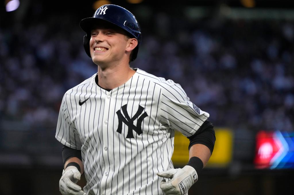 New York Yankees' Ben Rice reacting to fan cheers after flying out during a baseball game against Baltimore Orioles