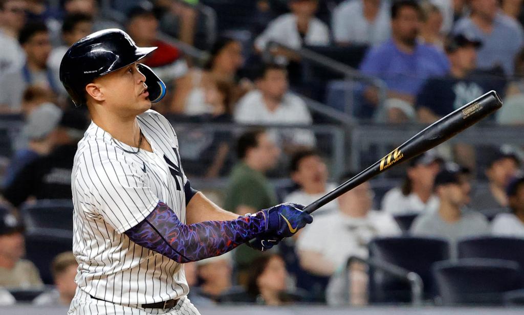 Giancarlo Stanton, New York Yankees designated hitter, watching his three run home run during a game against the Baltimore Orioles at Yankee Stadium