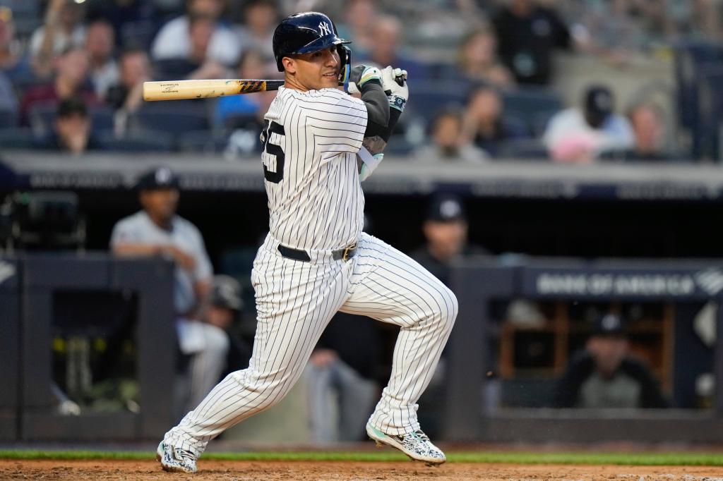 New York Yankees' Gleyber Torres swinging bat after making a two-run double against the Minnesota Twins during a baseball game
