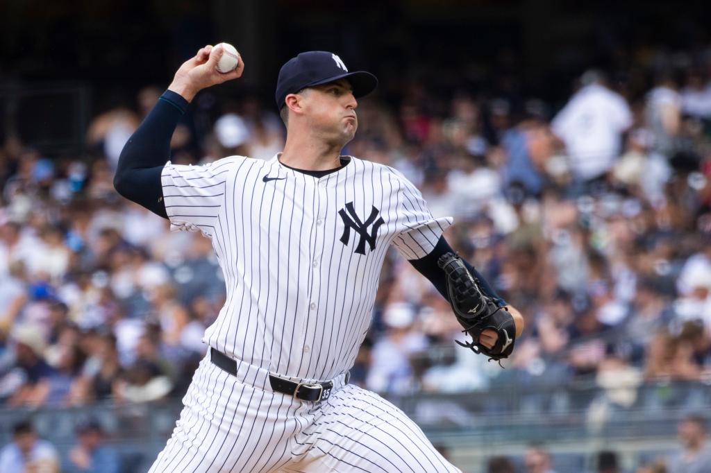 New York Yankees pitcher Clay Holmes throwing a ball in the ninth inning against the Atlanta Braves at Yankee Stadium on June 23, 2024.