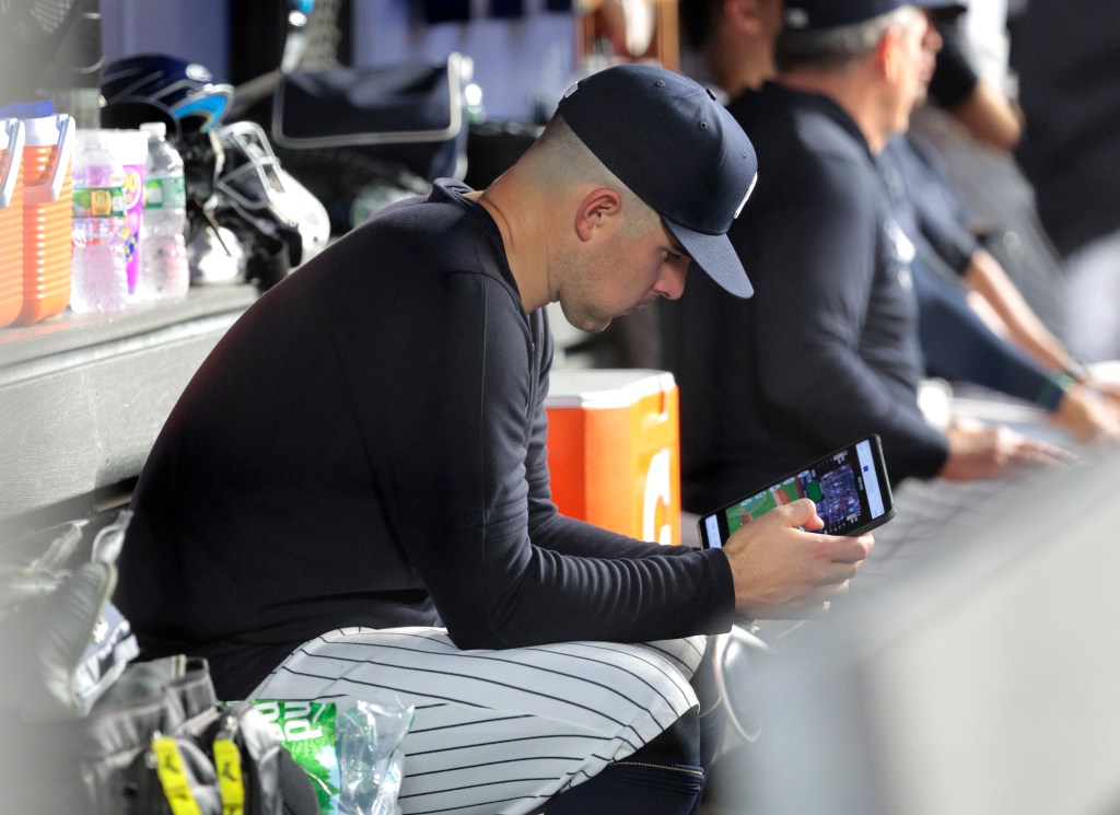 Yankees staring pitcher Carlos Rodón #55, sitting in the dugout during the 5th inning. Rodon was taken out of the game in the 4th inning.