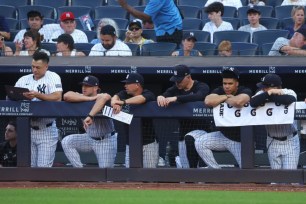 A dejected Yankees bench looks on during the ninth inning of the Bombers' 17-5 blowout loss to the Orioles.