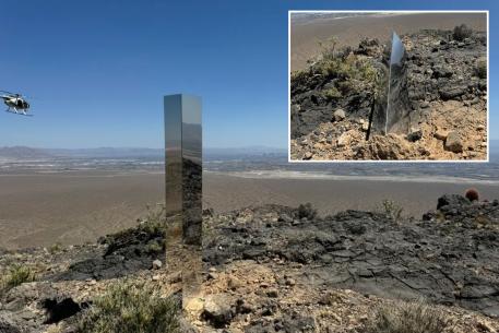 A metal post in the middle of a desert
