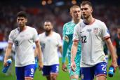 Dejected U.S. players walk off the field during their 2-1 loss to Panama.