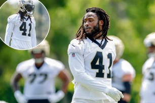 Alvin Kamara wearing a football uniform