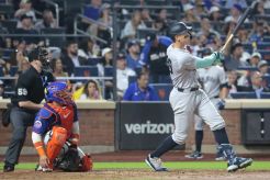Aaron Judge belts a two-run homer in the sixth inning of the Yankees' 12-2 Subway Series loss to the Mets.