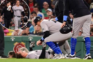 Anthony Rizzo exited after a collision at first base during Sunday's game against the Red Sox.