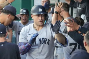 Giancarlo Stanton celebrates with teammates after blasting at two-run homer in the fifth inning of the Yankees' 11-5 win over the Royals.