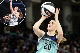 A woman in a basketball uniform