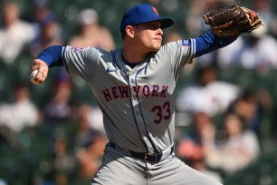 Drew Smith, who was placed on the IL, throws a pitch during the ninth inning of the Mets' win over the Cubs on Sunday.