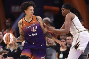 Brittney Griner, who scored 19 points, looks to make a move on Jonquel Jones during the Liberty's 99-93 loss to the Mercury.